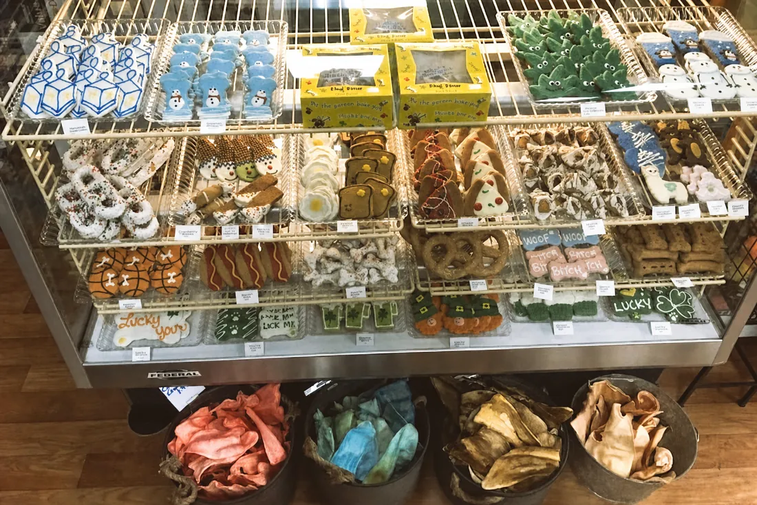 Bakery case of decorated dog treats and biscuits at Paradise Poochie